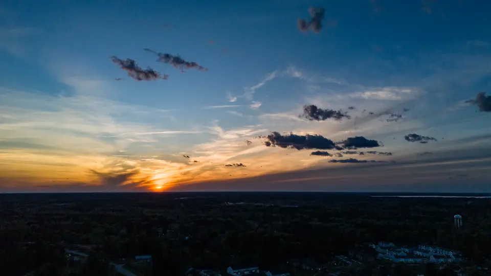 Drone view of the sun setting over the forests of Berkeley County, SC